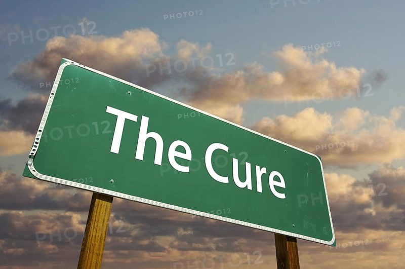 The cure green road sign with dramatic clouds and sky
