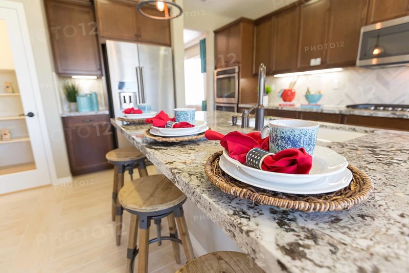 Abstract of beautiful kitchen granite counter place settings and chairs