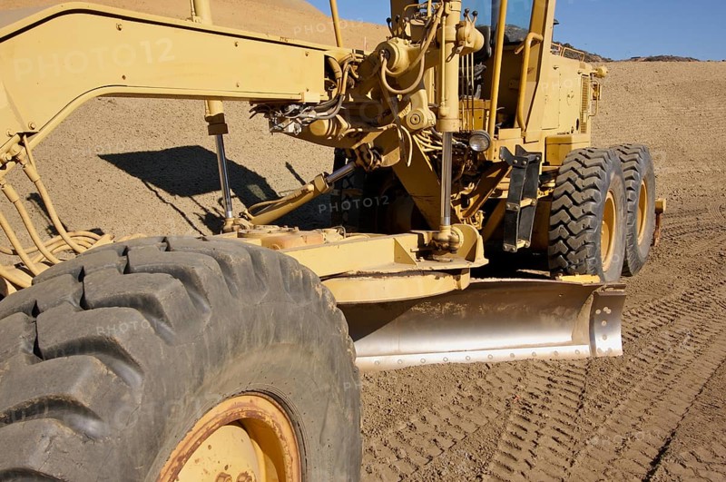 Tractor at a construction site and dirt lot
