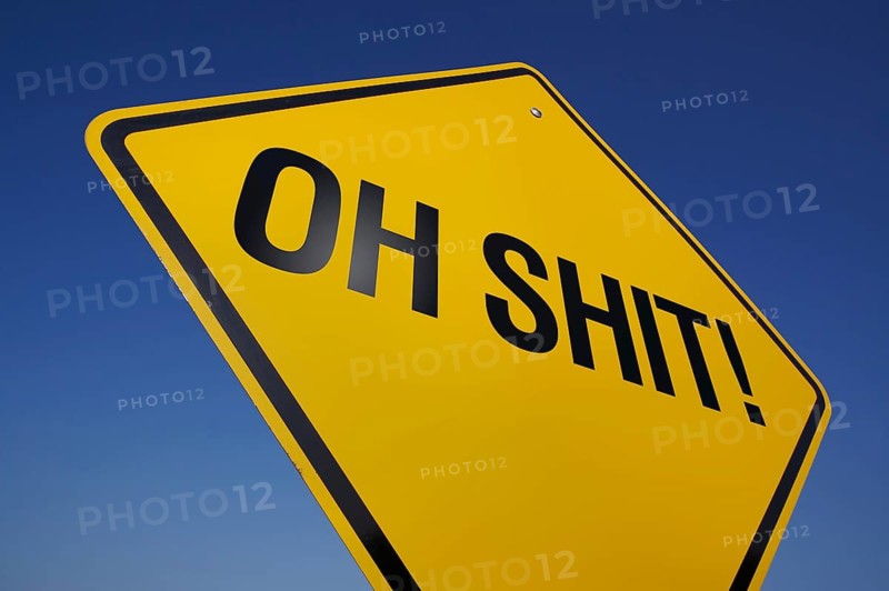 Yellow oh shit! road sign against A dramatic blue sky with clipping path