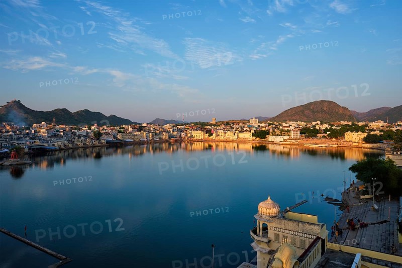 View of famous indian hinduism pilgrimage town sacred holy hindu religious city Pushkar amongst hills with Brahma mandir temple