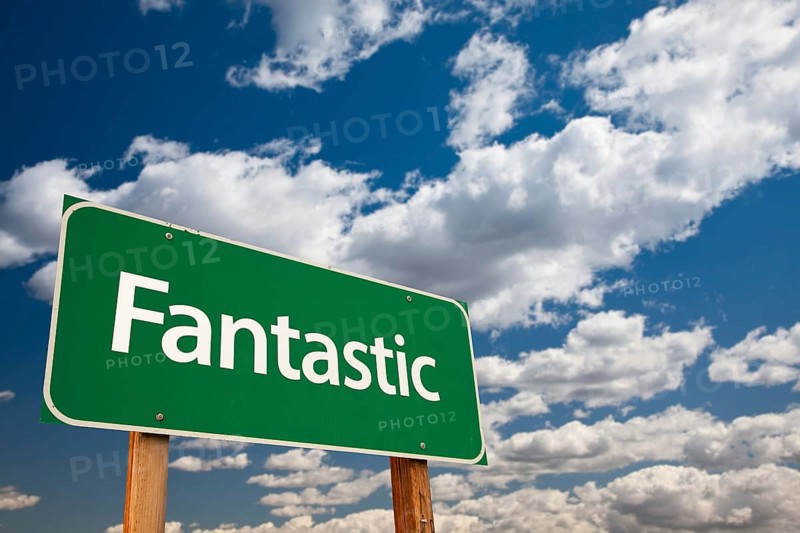 Fantastic green road sign with dramatic clouds and sky