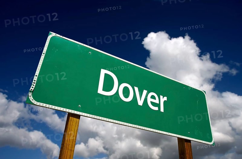 Dover road sign with dramatic blue sky and clouds