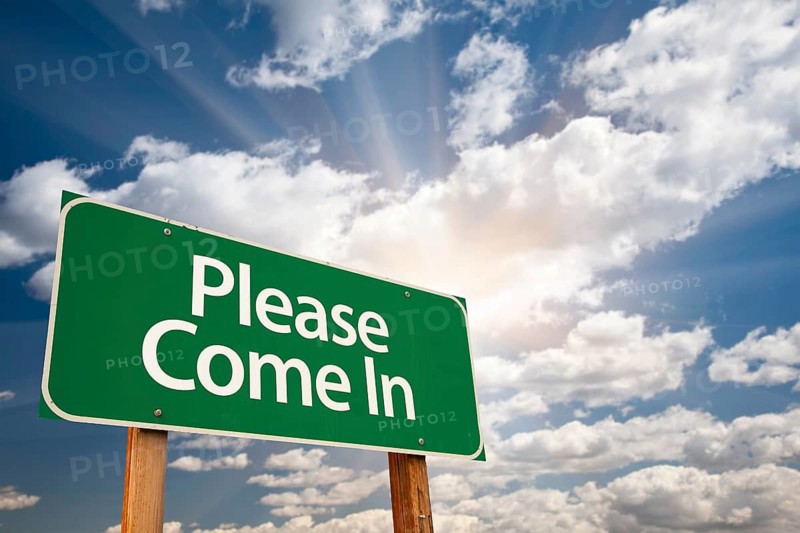 Please come in green road sign against clouds and sunburst