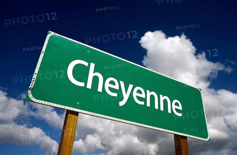 Cheyenne road sign with dramatic blue sky and clouds