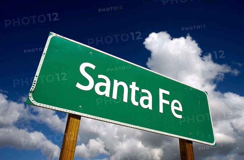 Santa fe road sign with dramatic blue sky and clouds