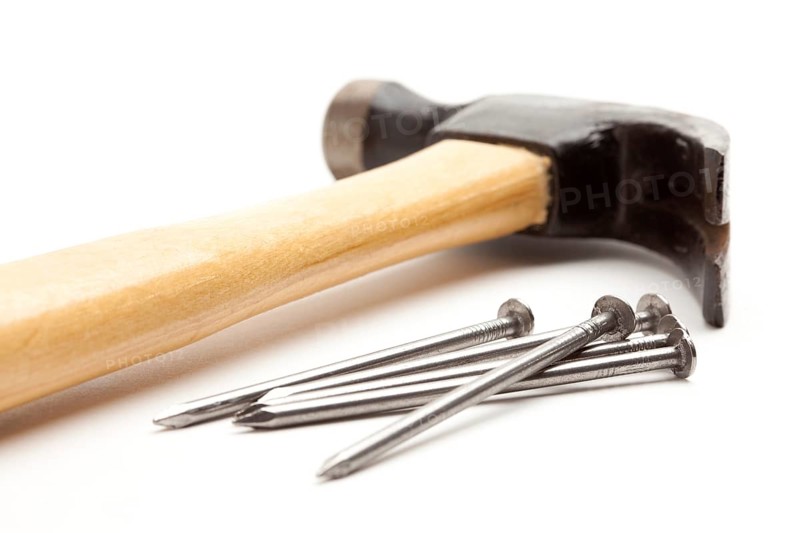 Hammer and nails isolated on a white background