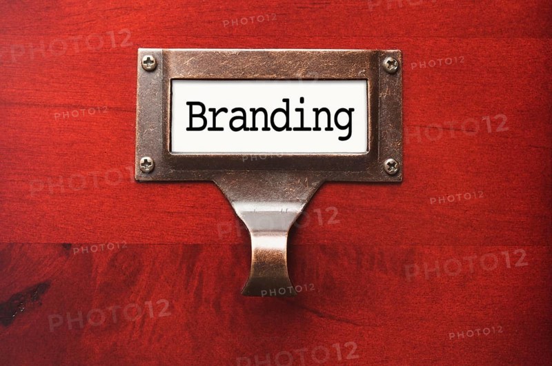 Lustrous wooden cabinet with branding file label in dramatic light