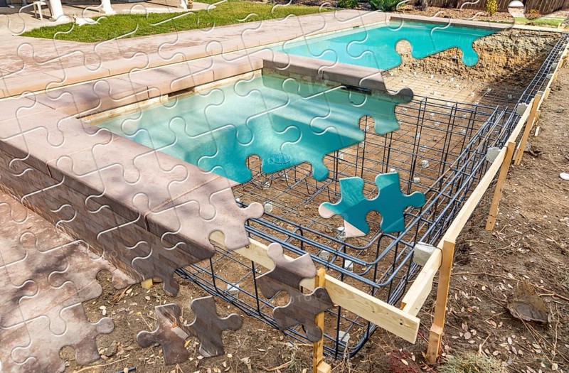 Puzzle pieces fitting together revealing finished pool build over construction