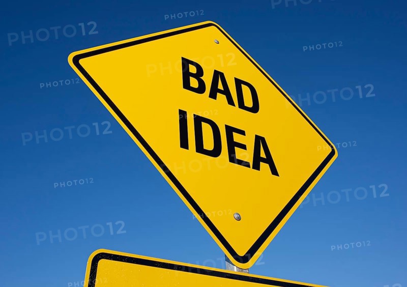Yellow bad idea road sign against A deep blue sky with clipping path