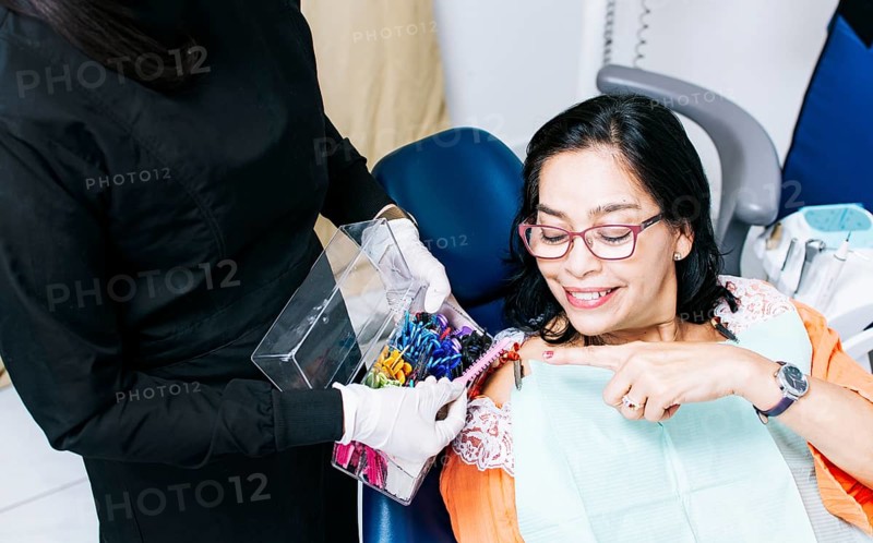 Patient with dentist choosing dental braces