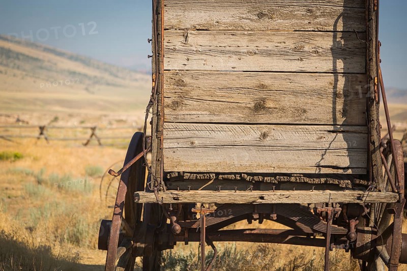 Abstract of vintage antique wood wagon in meadow