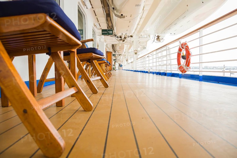 Abstract deck view of luxury passenger cruise ship and railing