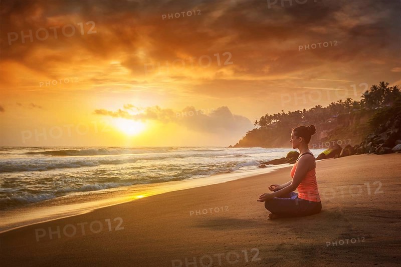 Young sporty fit woman doing yoga