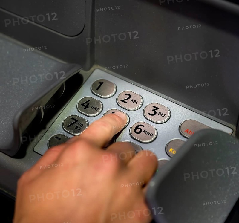 Hand at an ATM