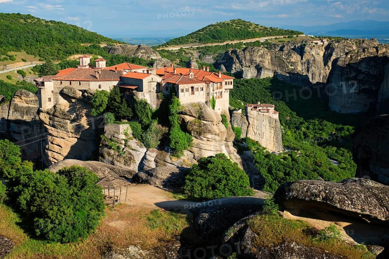 Monastery of Varlaam monastery and Monastery of Rousanou in famous greek tourist destination Meteora in Greece on sunset with scenic scenery landscape