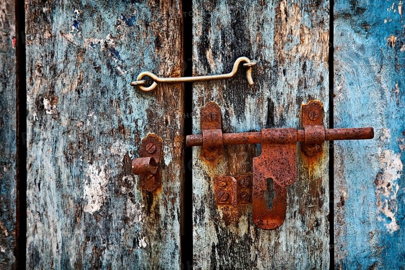 Old rusty latch on the door