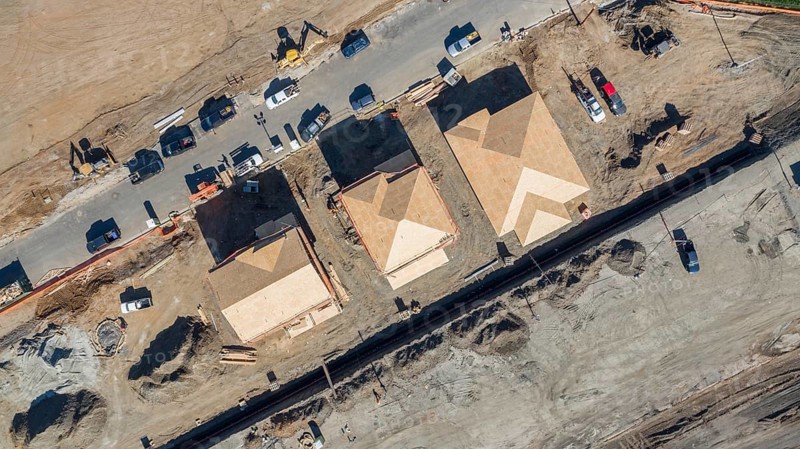 Drone aerial view of home construction site early stage