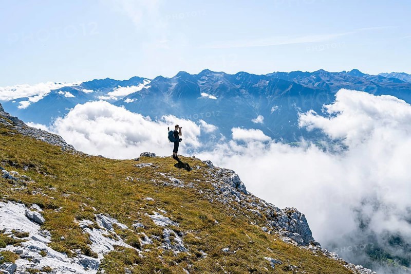 Hikers above the clouds