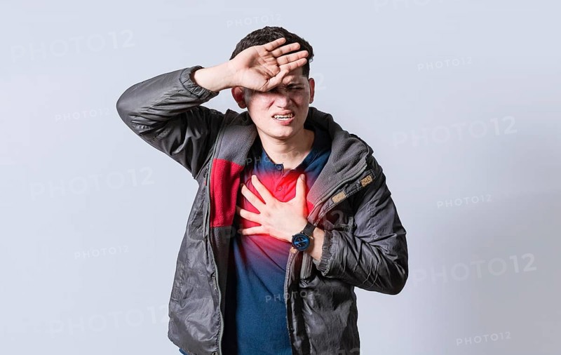 Man with heart pain on isolated background