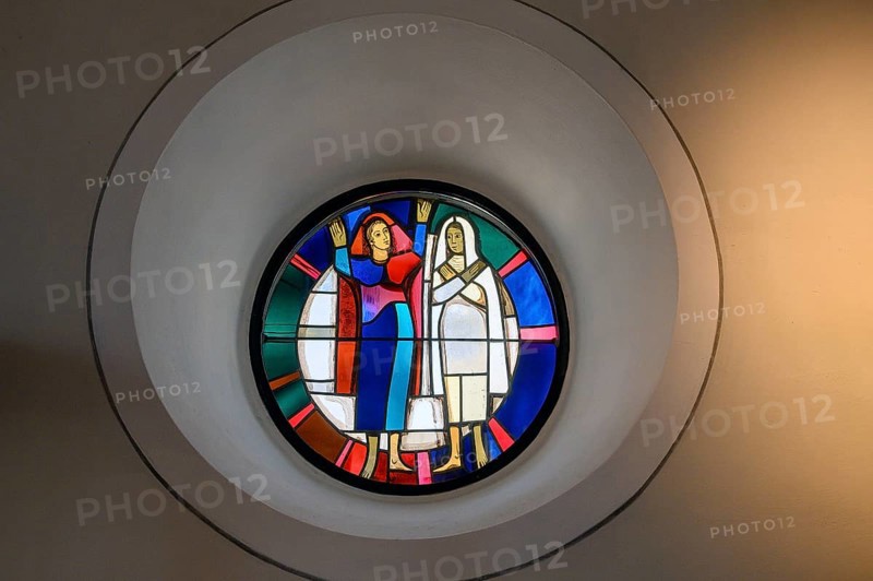 Modern church window with two figures