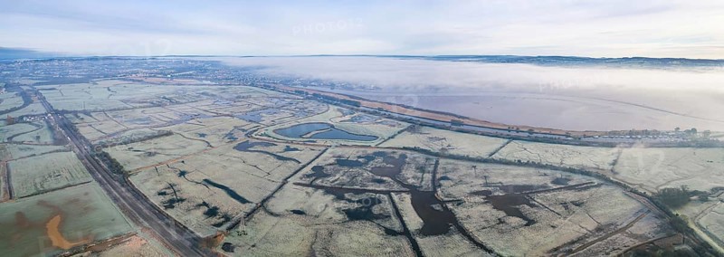 RSPB Exminster and Powderham Marshes and River Exe from a drone at sunrise