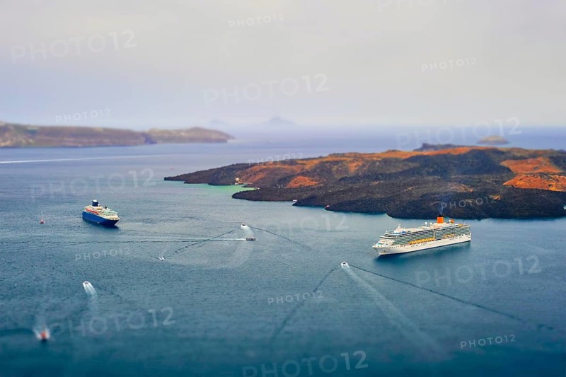 Cruise ships and tourist boats in sea Greek isaldn Santorini
