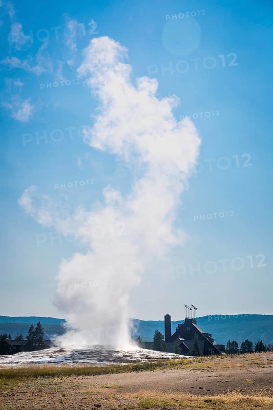 Old faithful geyser erupting at yellowstone national park