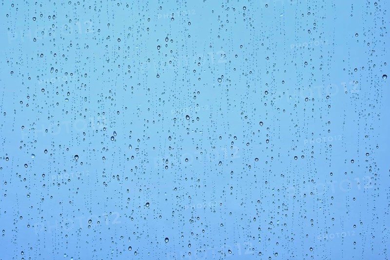 Rain water drops droplets on window glass texture background