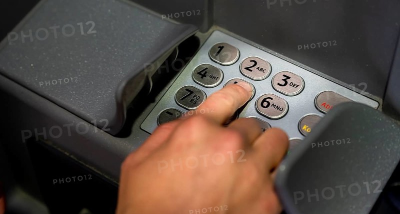 Hand at an ATM