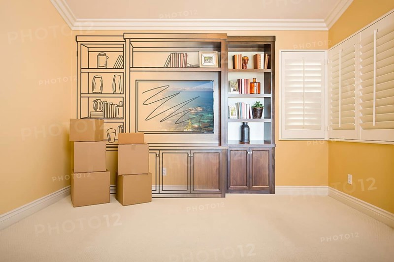 Moving boxes in room with entertainment unit drawing gradating to photograph