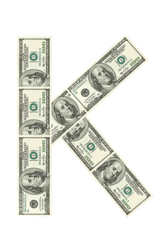 Letter K made of dollars isolated on white background