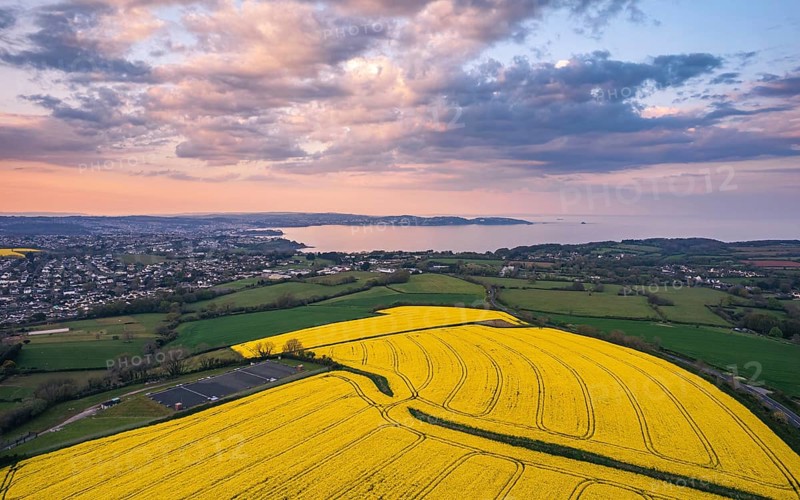 Sunset over Devon Fields and Farmlands from a drone
