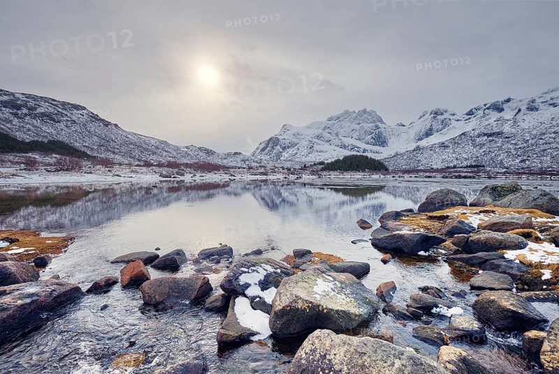 Sunset in Norwegian fjord in winter. Lofoten islands
