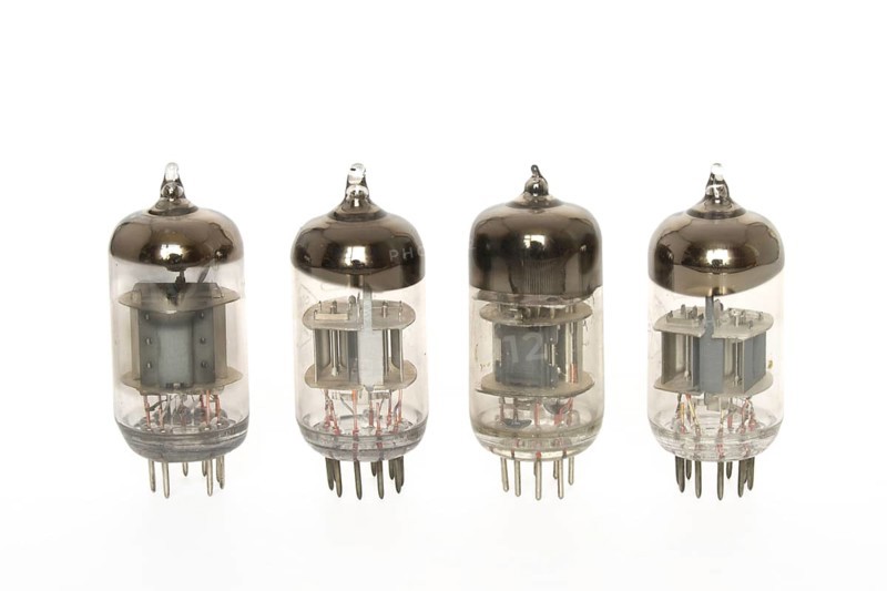 Old vacuum tubes on white background