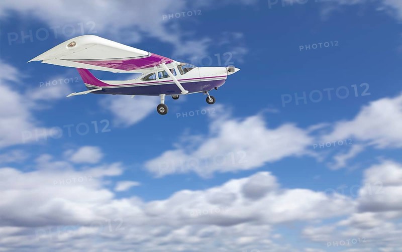 The cessna 172 single propeller airplane flying in the sky