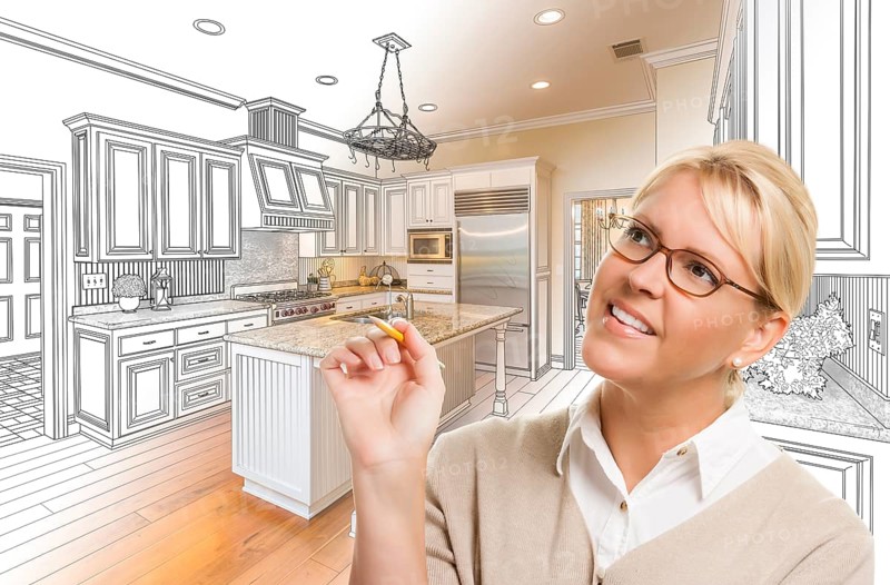 Creative woman with pencil over custom kitchen design drawing and photo combination