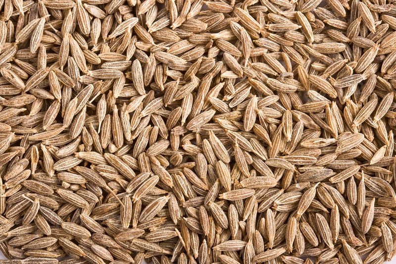 Pile of cumin spice close up