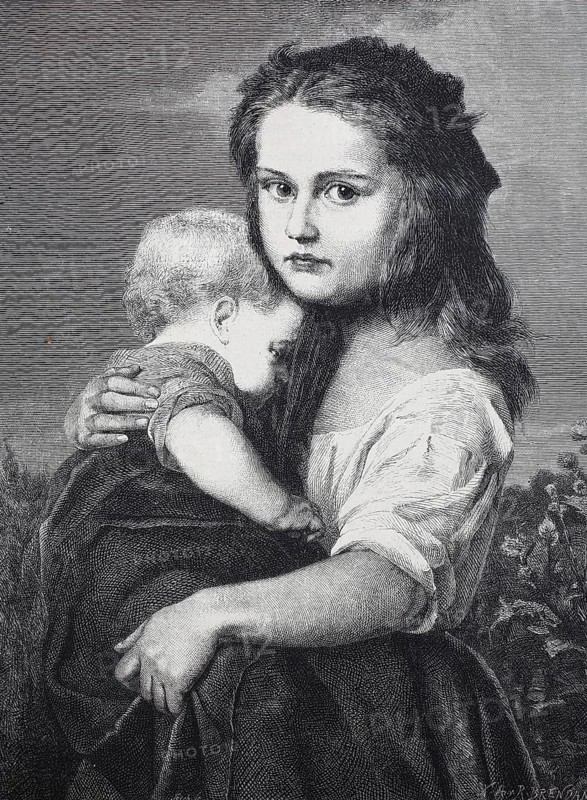 A child holds his sister in his arms