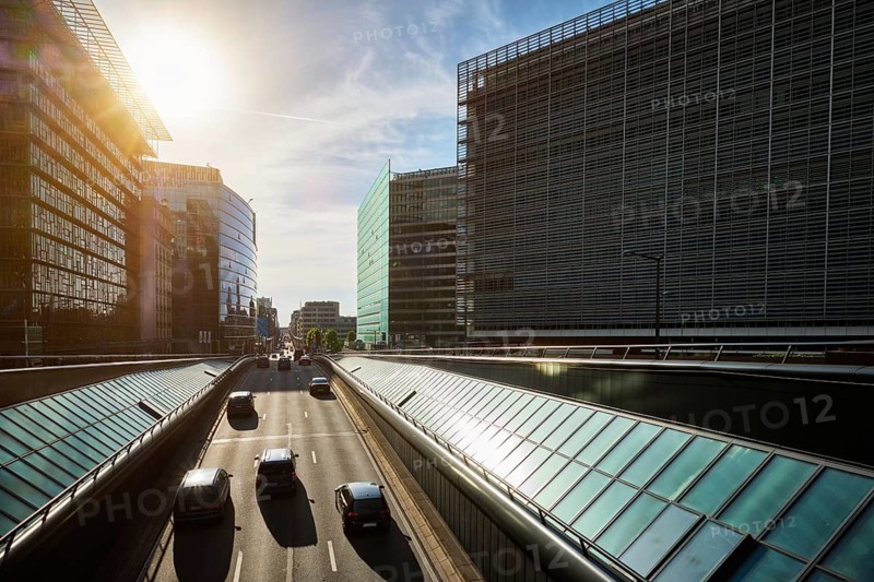 Street traffic in Brussels near European Commission building on sunset Rue de la Loi