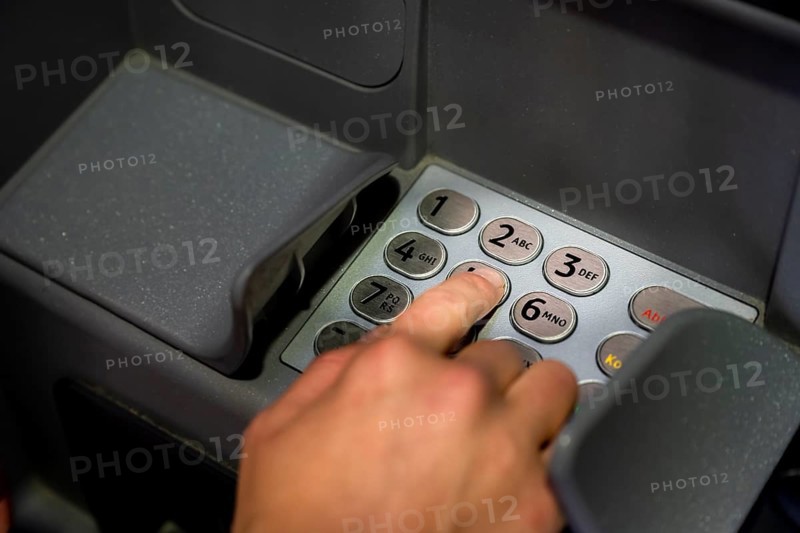 Hand at an ATM