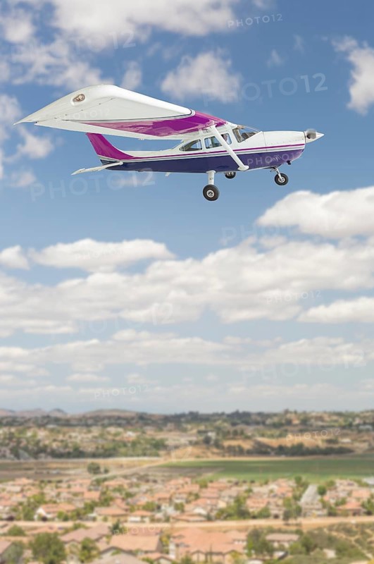 The cessna 172 single propeller airplane flying in the sky