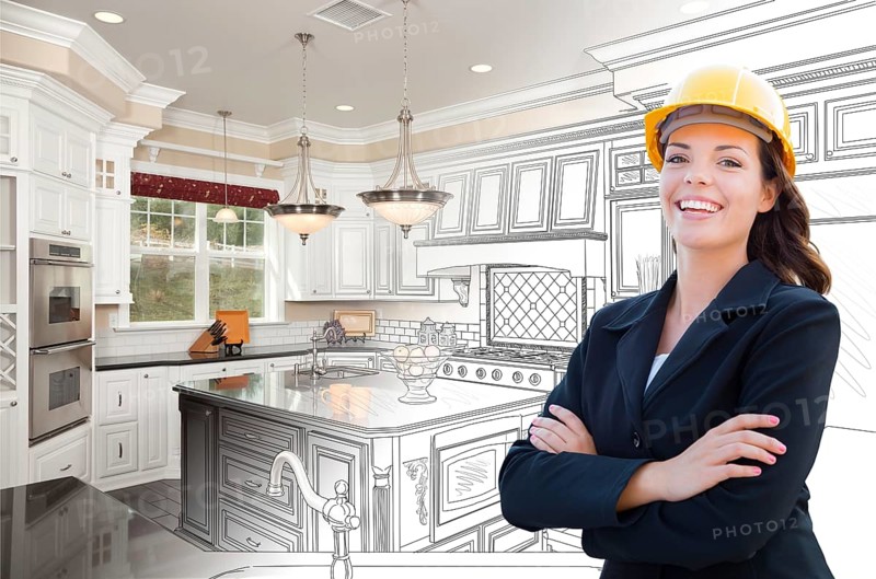 Smiling female contractor over kitchen drawing gradating to photo