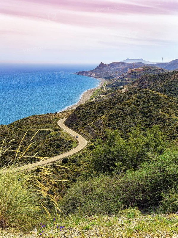 View from above of winding coastal road in hilly landscape. Cabo de Gata Nijar nature Park