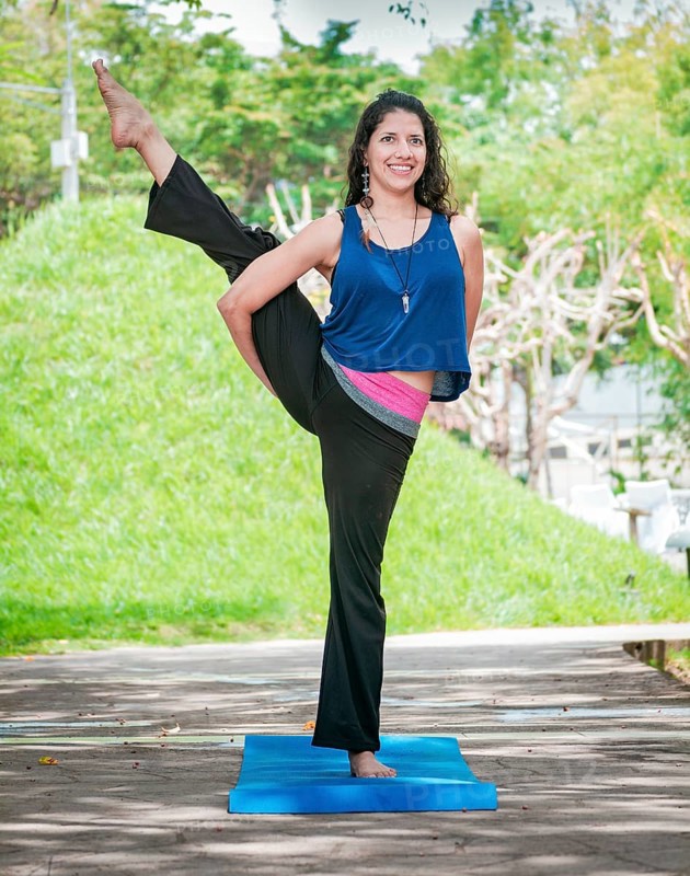 Girl doing yoga bird of paradise
