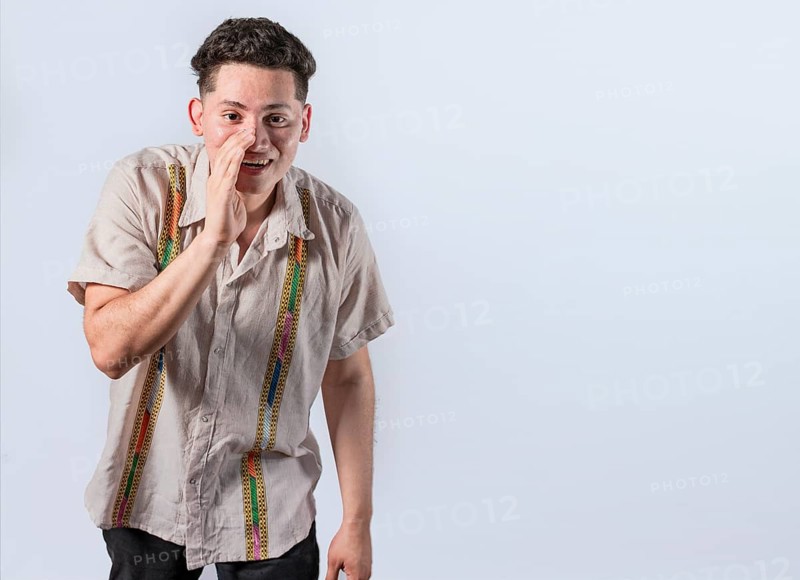Man speaking discreetly to the camera