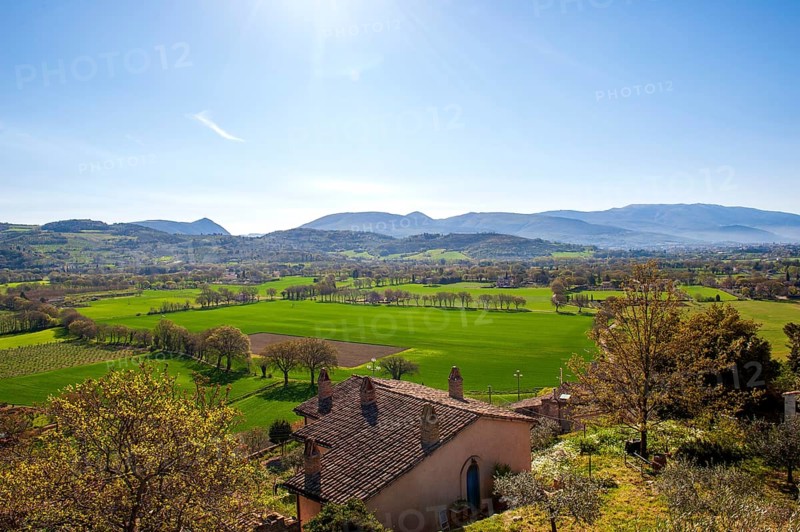 View of the green Umbrian countryside from the old town of Spello