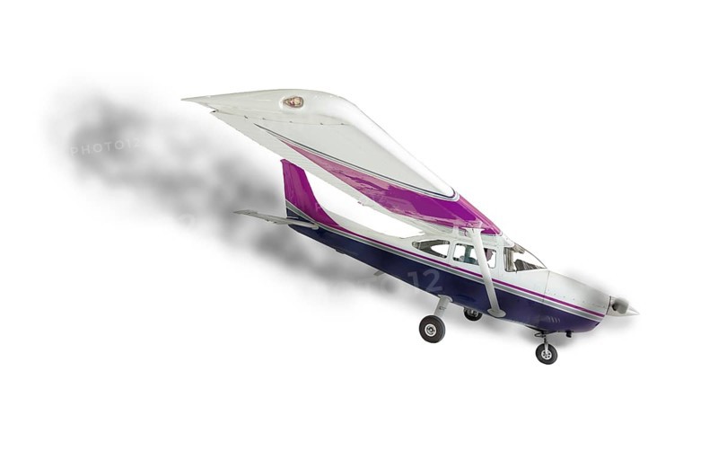 The cessna 172 with smoke coming from engine on a white background