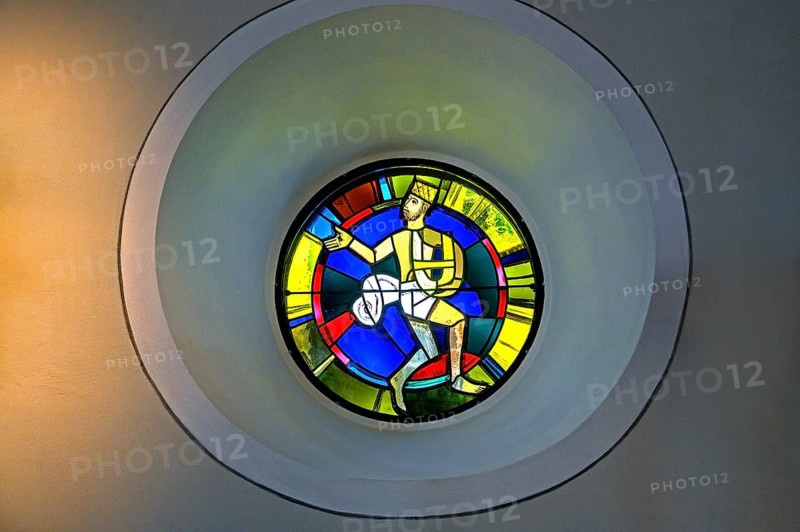 Modern church window with a figure
