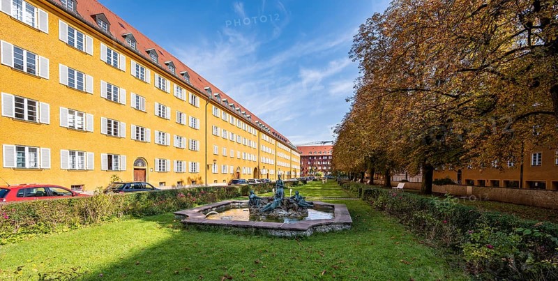 Inner courtyard with park and yellow apartment buildings